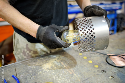 Εκτύπωση καμβά Metalwork craftsman making handmade lamp at workshop