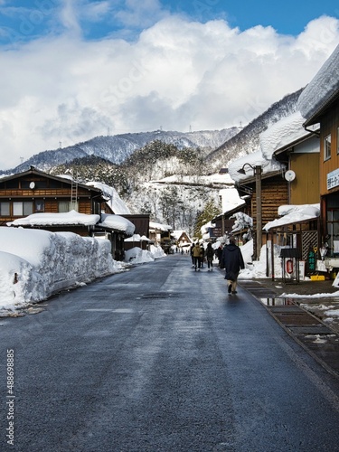Shirakawago, Japan - February 18, 2022 : A snow-covered street in Shirakawago village in winter, recorded on February 18, 2022. 
