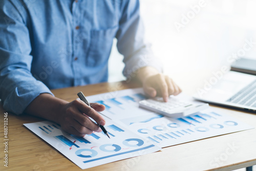 Financial businesswomen analyze the graph of the company's performance to create profits and growth, Market research reports and income statistics, Financial and Accounting concept.