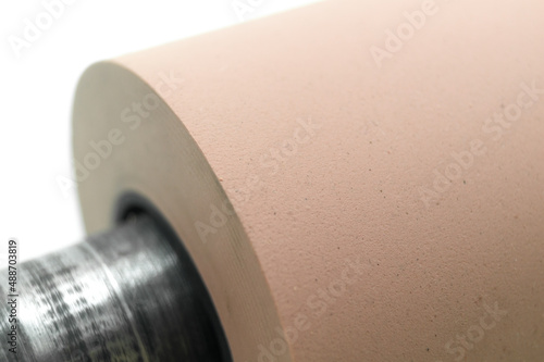 Anilox roller for flexographic printing machine. Raster cylinder for transferring ink to the printing roller. Selective focus, isolated on white