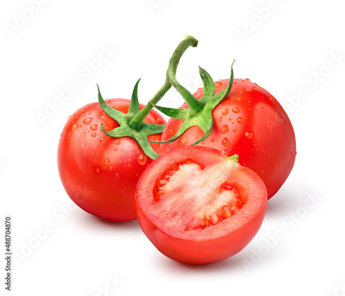 Fresh tomatoes with cut in half and water droplets isolated on white background.