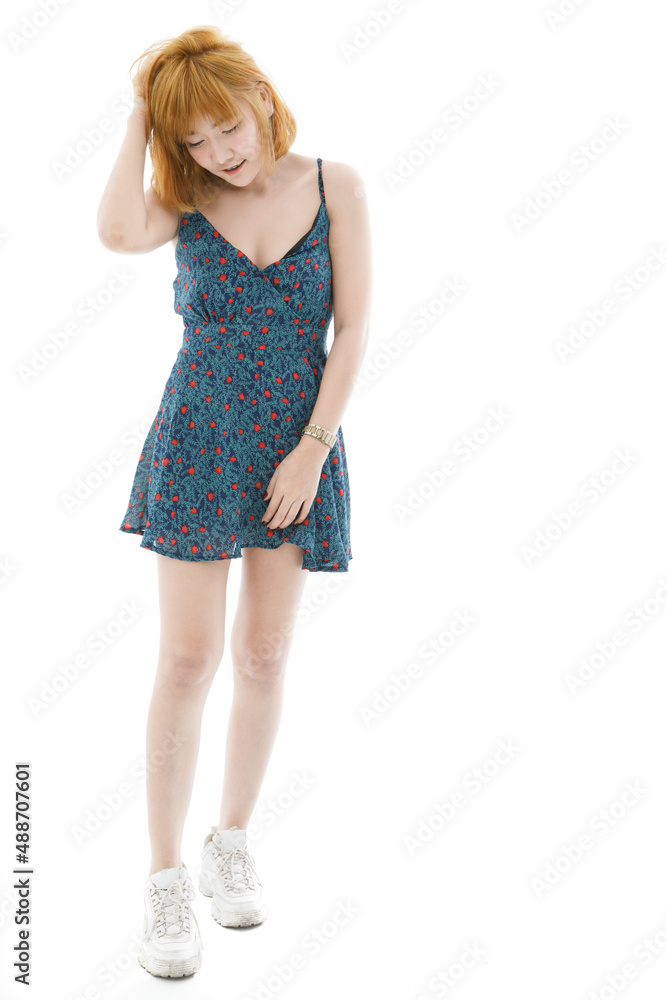 Isolated cutout studio full body shot of Asian young sexy blonde short hair female fashion model in camisole dress and sneakers standing look at camera on white background Isolated cutout studio full body shot of Asian young sexy blonde short hair female fashion model in camisole dress and sneakers standing look at camera on white background