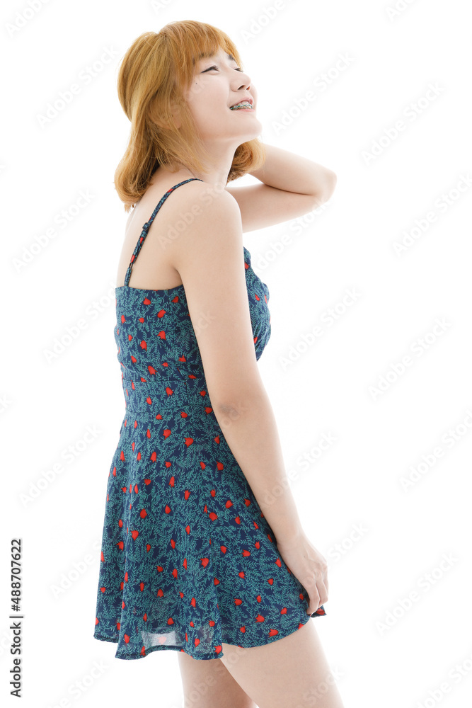 Isolated cutout studio full body shot of Asian young sexy blonde short hair female fashion model in camisole dress and sneakers standing look at camera on white background Isolated cutout studio full body shot of Asian young sexy blonde short hair female fashion model in camisole dress and sneakers standing look at camera on white background