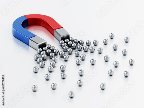 Horseshoe magnet attracts groups of metal spheres. 3D illustration