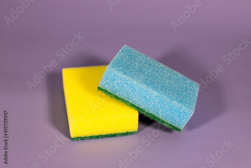 two colored washcloths on a purple background