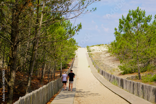 young retired couple go to the sandy beach