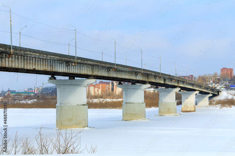 part of the automobile bridge of Siberian tract from Moscow to Irkutsk on river Tom. selective focus
