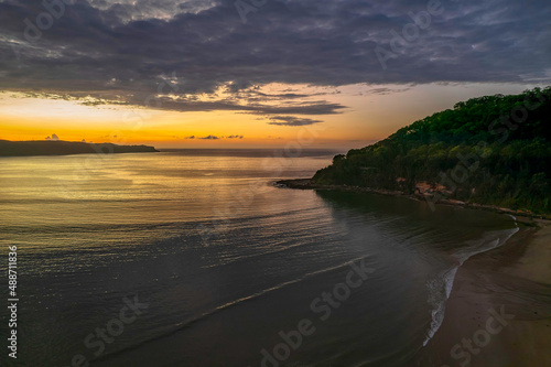 Aerial sunrise seascape with  low clouds