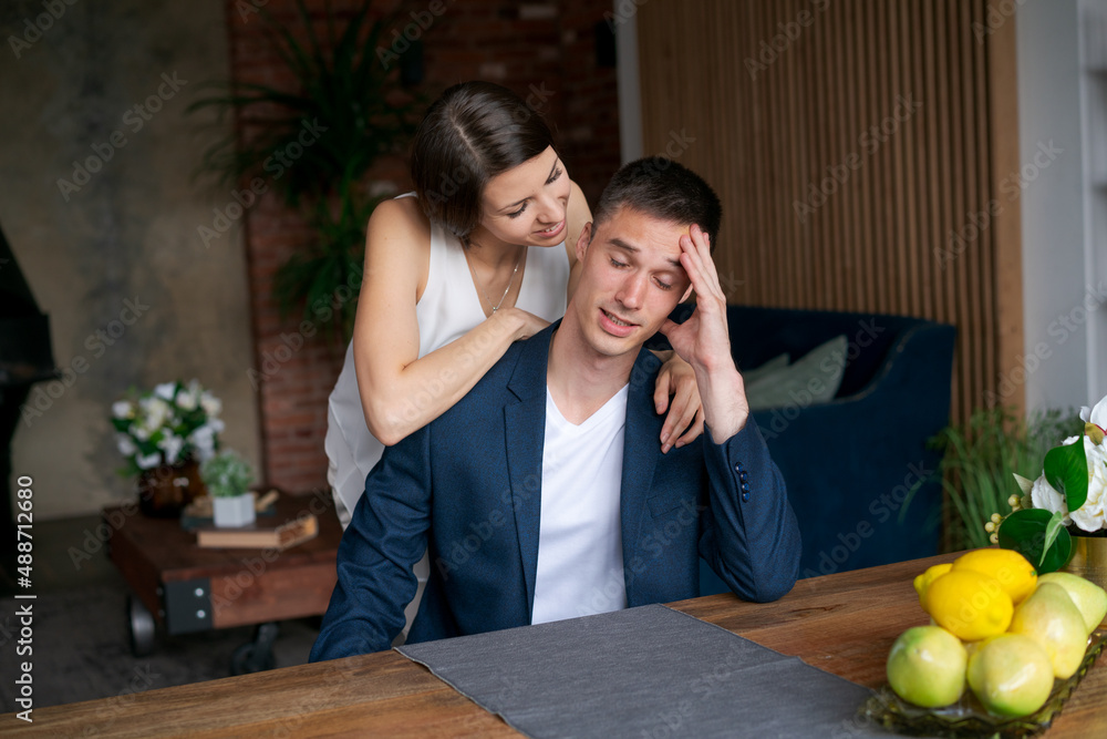 Two handsome people, business partners and colleagues, standing side by