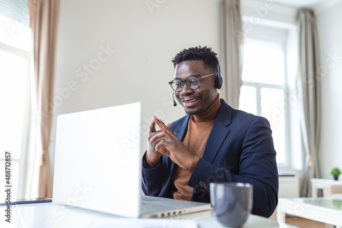 Wallpaper Mural Excited African American man wearing headphones reading good news in email, getting new job, promotion, using laptop, looking at screen and screaming with joy, showing yes gesture, celebrating Torontodigital.ca
