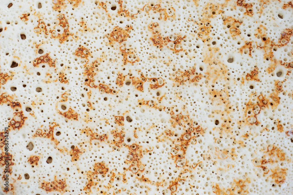 Pancake texture, baked pancake dough background. Close up. Pancake texture, baked pancake dough background. Close up.