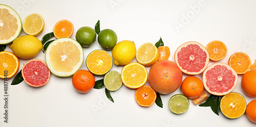 Different citrus fruits on white background  top view