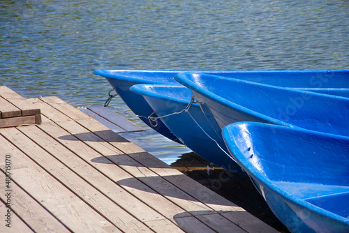 Close-up of the front of the boats standing on the pier