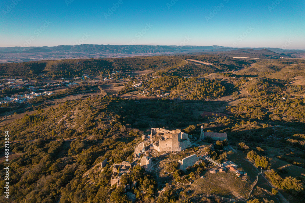 Aerial view of a Medieval ruined stone castle on the mountain, Aumelas Castle in France