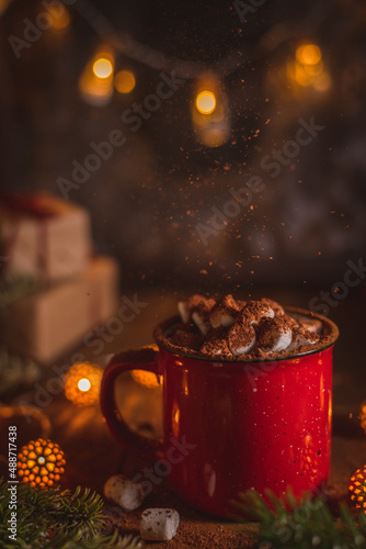 red cup with cocoa and marshmallows and cinnamon. Christmas, New Year's composition