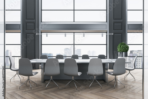 Grey shades classic interior design of modern conference room with stylish furniture on wooden parquet floor and city view from big window. 3D rendering © Who is Danny