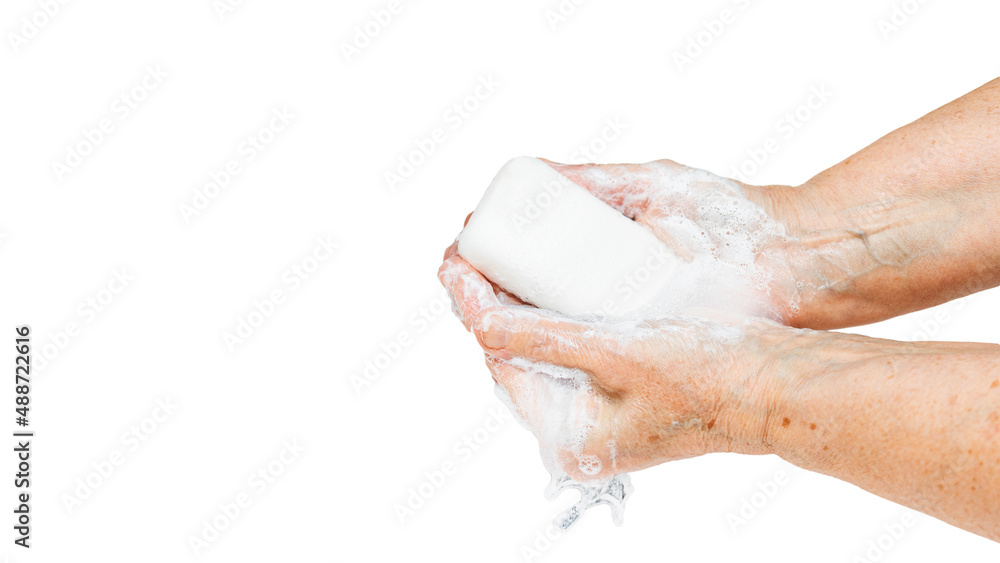Old woman washing hands with soap, isolated on white background Old woman washing hands with soap, isolated on white background
