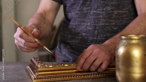 Framing Workshop. Painting baguette handmade picture frame at studio.