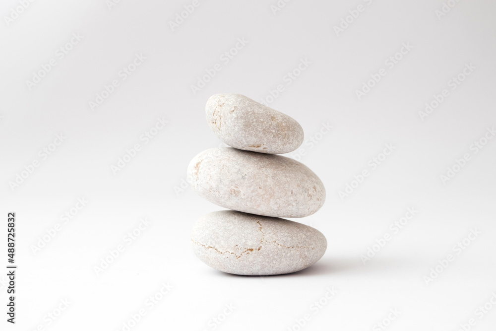 a stack of balancing stones on white background a stack of balancing stones on white background