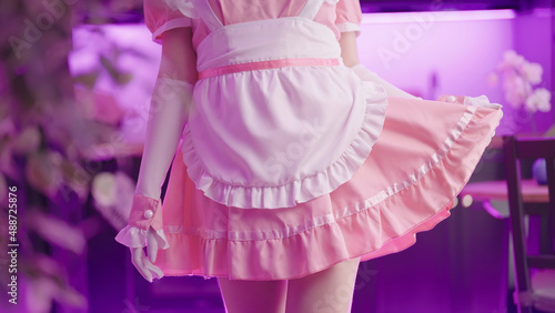 Tableau sur toile Headless retro pink maid anime cosplay girl hold up the skirt