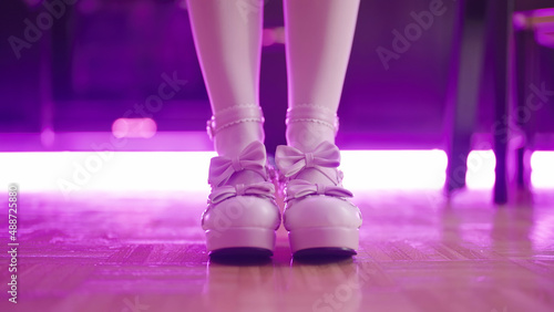 Pink lolita high heels platform shoes with led tube lights in background
