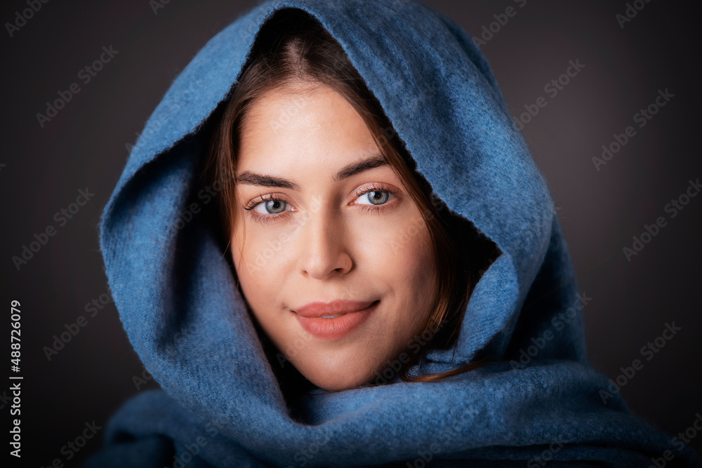 Studio portrait of beautiful girl wearing blue scarf on her head Studio portrait of beautiful girl wearing blue scarf on her head