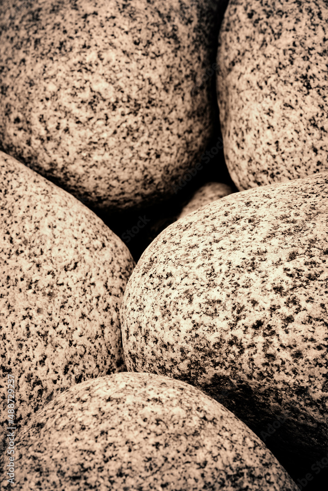 Full frame natural abstract background with round granite stones in sepia style. High resolution image, perfect for interior decoration in Healing by Nature Fine Art Design style. Full frame natural abstract background with round granite stones in sepia style. High resolution image, perfect for interior decoration in Healing by Nature Fine Art Design style.