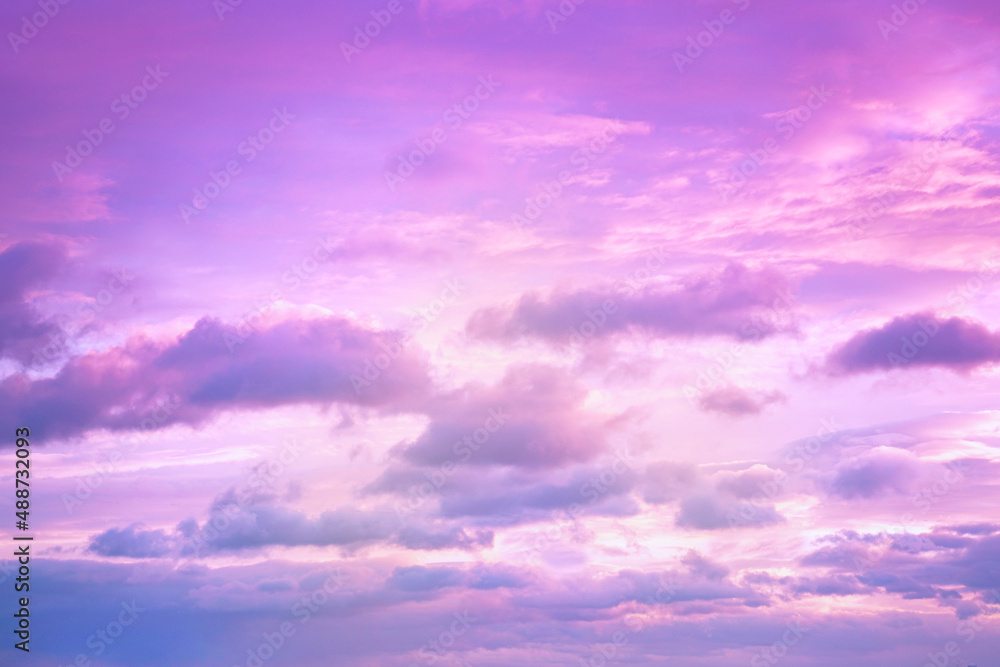 Pink purple sky with clouds. Beautiful sunset. Delicate background for design.