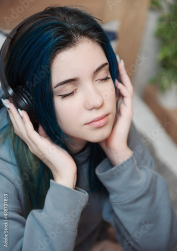Happy teenager listening to music