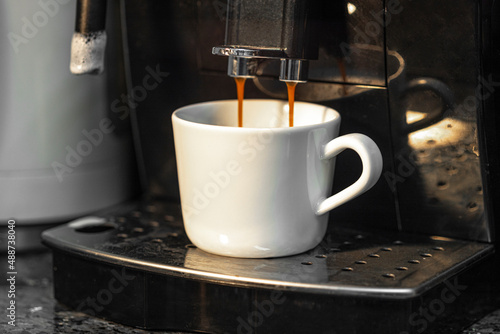 Espresso machine for making fresh coffee on a dark background close-up. Coffee preparation.