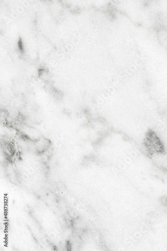 White marble texture background pattern top view. Tiles natural stone floor with high resolution. Luxury abstract patterns. Marbling design for banner, wallpaper, packaging design template. © Maksim