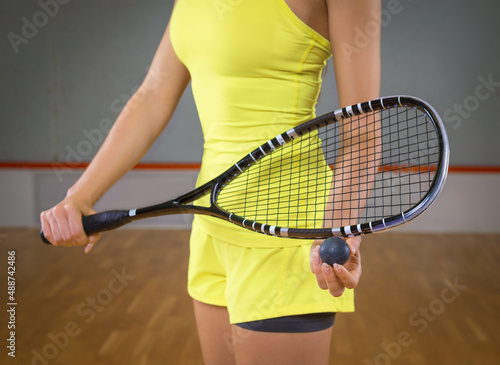 Image of a woman playing squash. Sports concept. © andy_gin