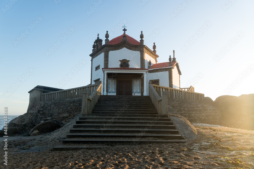 Capela do Senhor da Pedra or Lord of the rock chapel at sunset, Miramar, Portugal