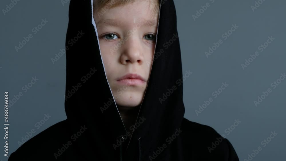 Portrait Little Child Boy in Hood Looking at Camera, Sad Thinking Offended Face Looking at Camera, closeup Portrait Little Child Boy in Hood Looking at Camera, Sad Thinking Offended Face Looking at Camera, closeup