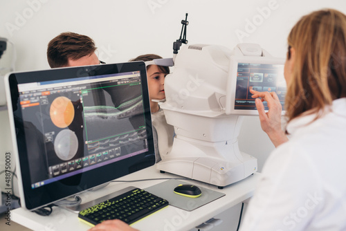 child having eye examination.digital retina scan photo