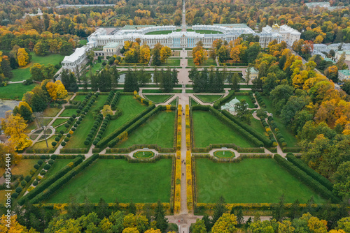 Aerial view of Catherine Park in Tsarskoye Selo of Pushkin, autumn garden from above, patterns and lines of paths, yellow leaves on branches