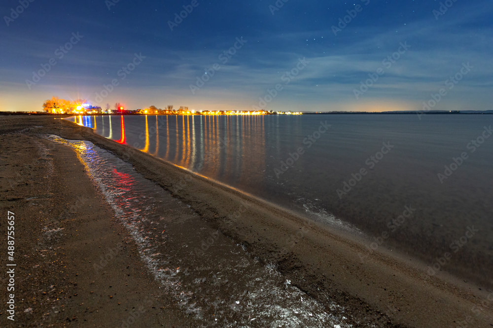 Frozen beach of the Baltic Sea in Rewa at night, Poland