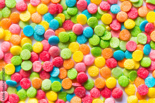 Background of colorful candies. Rainbow topping for topping ice cream and cakes. Happy Easter! 