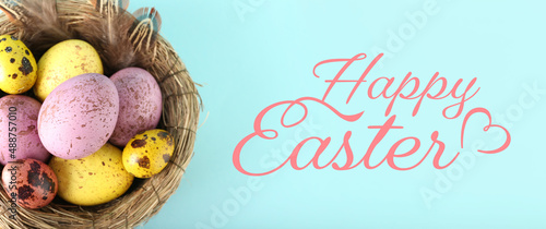 Beautiful Easter greeting card with painted eggs in nest