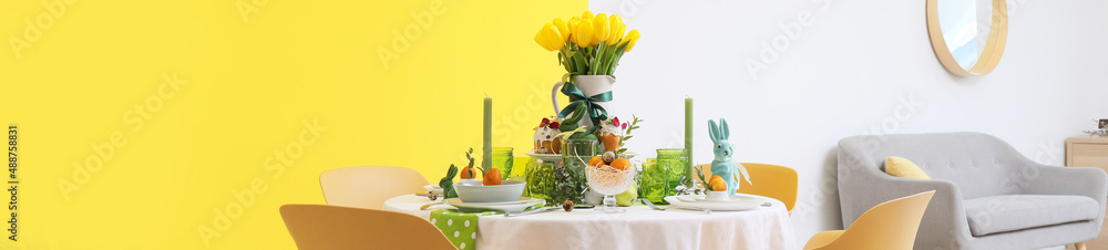 Beautiful dining table served for Easter celebration in room