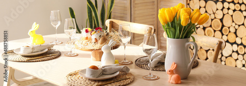 Dining table served for Easter celebration in light room