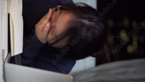 a cute Vietnamese girl is laughing uncontrollably in front of the camera