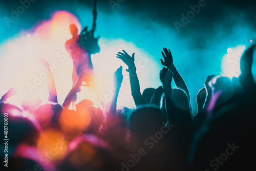 Fototapeta Naklejka Na Ścianę i Meble -  crowd with raised hands at concert - summer music festival