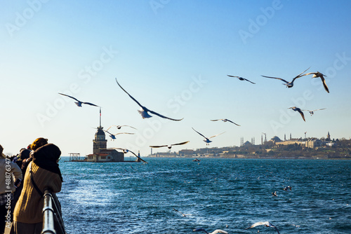 Uskudar. Maiden's Tower and seagulls with cityscape of Istanbul photo