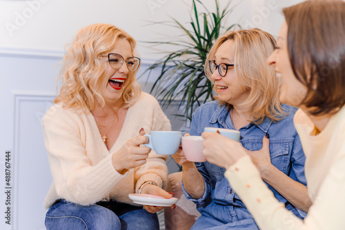 Photography Three women drink tea together