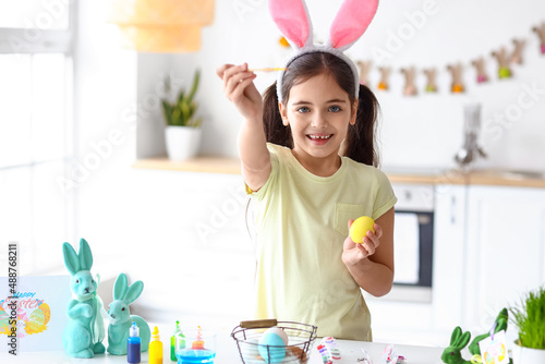 Funny little girl painting ...