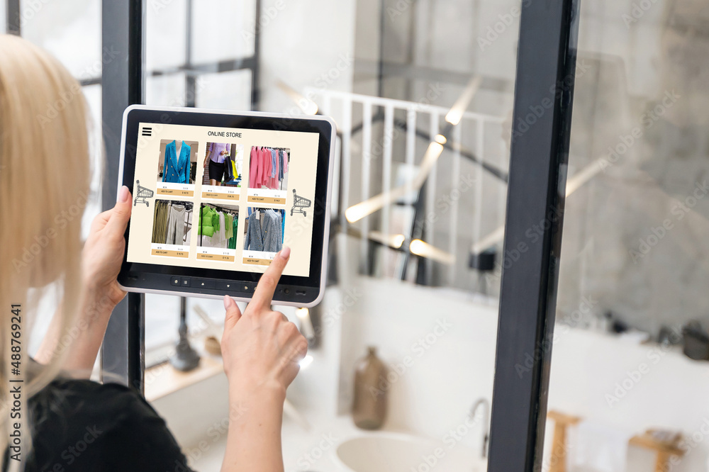 Woman shopping for clothes online. woman using tablet Woman shopping for clothes online. woman using tablet