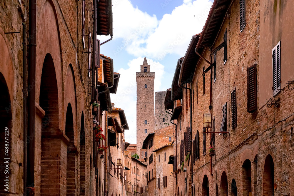 Close up view on the medieval facades and historic high towers of old town San Gimignano in Tuscany Italy