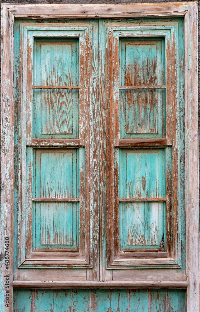 Locked window shutter in San Sebastian de La Gomera, the capital of the Canary Island of Gomera