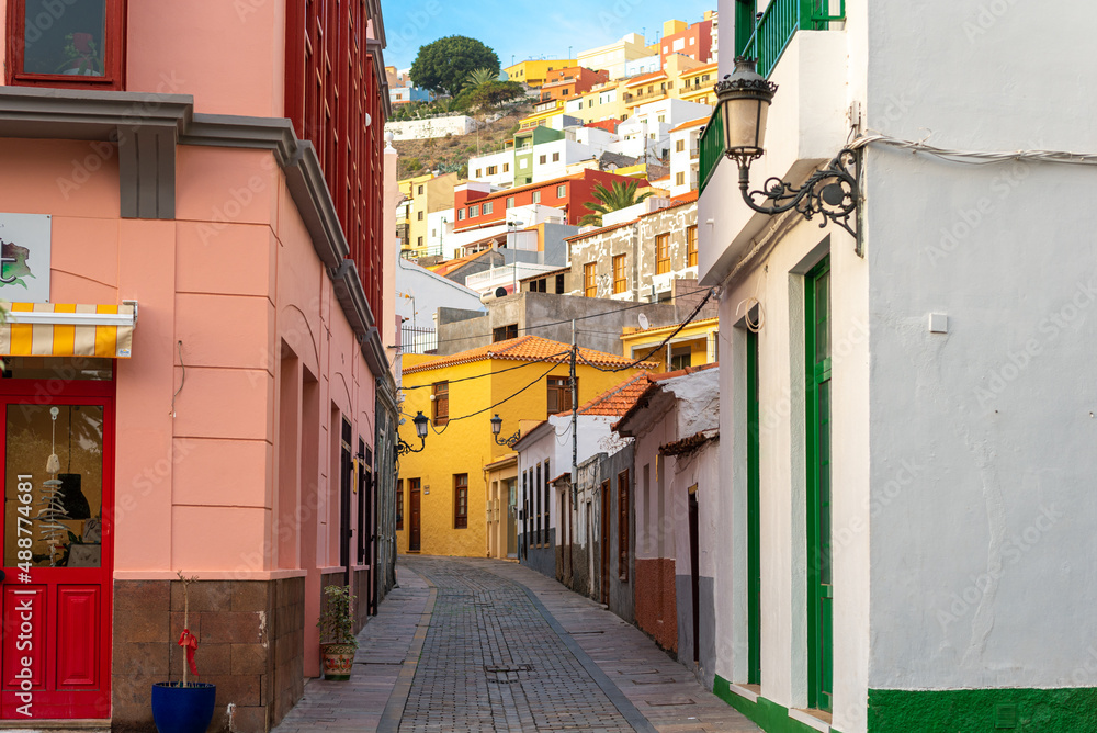 Fototapeta premium Streets and alleys in San Sebastian de La Gomera, the capital of the Canary Island of Gomera. The colorful houses stretch from the hill down to the sea